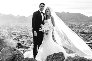 Erika and Charlie Kirk wedding portrait in Scottsdale, Arizona, with mountains in the background