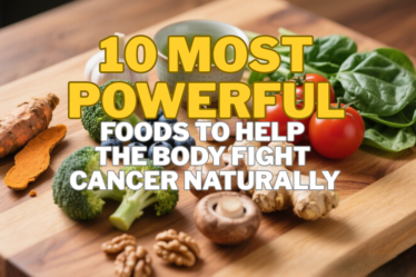 Flat-lay of vibrant anti-cancer superfoods arranged on a wooden butcher block, including turmeric, blueberries, broccoli, garlic, spinach, mushrooms, tomatoes, ginger, walnuts, and green tea.