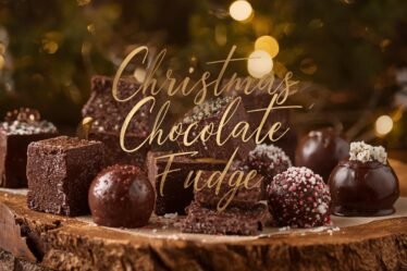 Christmas chocolate fudge squares and fudge balls with light festive sprinkles on a rustic holiday background