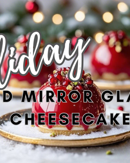 Red mirror glaze cheesecake with biscotti crust topped with pomegranate and pistachio garnish