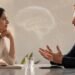 Man and woman in thoughtful conversation with subtle brain imagery representing neuroscience and intelligence research